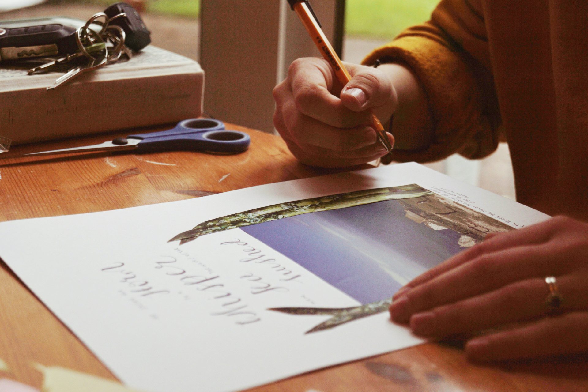 person holding pencil
